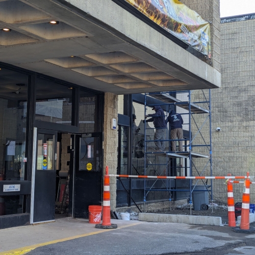 Photo: Workers start the process of removing glass in order to make way for the installation of steel beams. (12/1)
