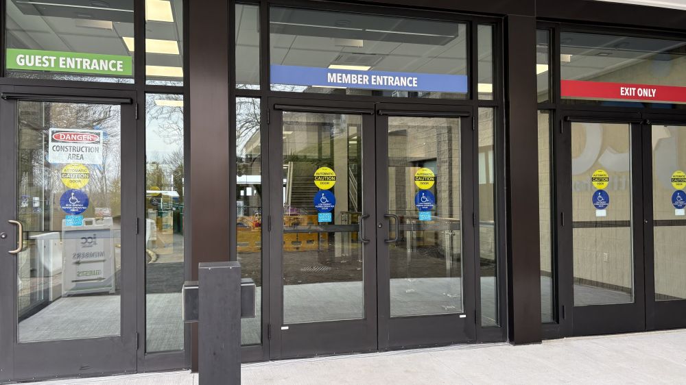 3/30: The new entrance doors as seen from the exterior, with Guest entrance on the left, Member entrance in the center, and Exit doors on the right.
