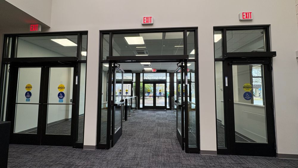 3/30: New doors as seen from inside the lobby, with Exit doors on the left, and Guest/Member entrance doors on the right/center.